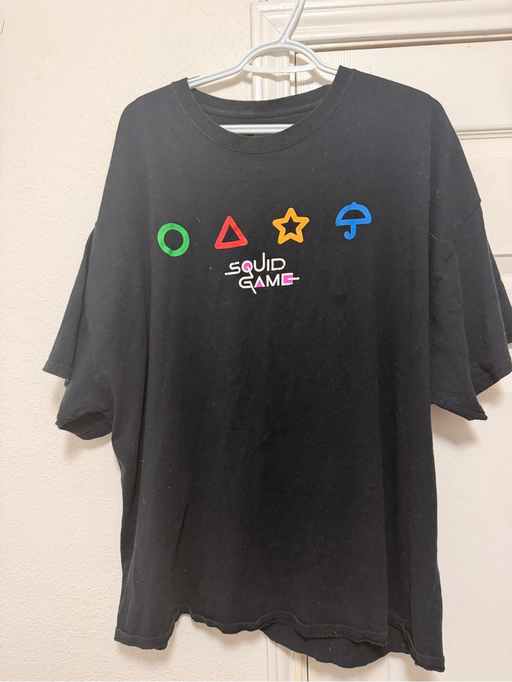 Black Squid Game Graphic Tee with Multicolor Symbols